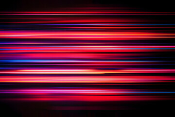 The effect of red light in fast motion on a black background. blurred abstract background with long exposure. neon light