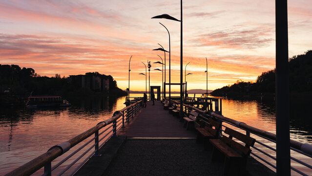 Dock of Pucon city at colorful sunset view landscape. Araucania Region, Chile