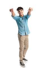 young man in casual denim shirt pointing fingers and giving cheerful recognition