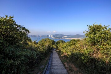 Fototapeta premium Hiking Trail with Panoramic View of Coastal City