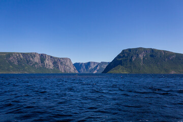 Majestic Mountain Range Overlooking Tranquil Ocean Waters