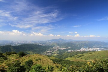 Fototapeta premium Scenic Cityscape View from Mountain Peak on a Clear Day, Tai Mo Shan, Hong Kong
