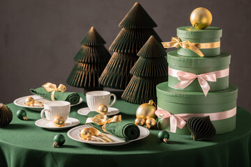 Lovely green table set for Christmas with bubbles and gifts.