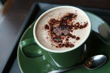 A steaming cup of coffee, ready to awaken the senses