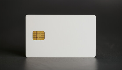 White credit card with gold chip on dark backdrop. Money, finance and banking concept.