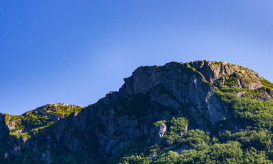 Majestic Rocky Mountain Peak Against Clear Blue Sky