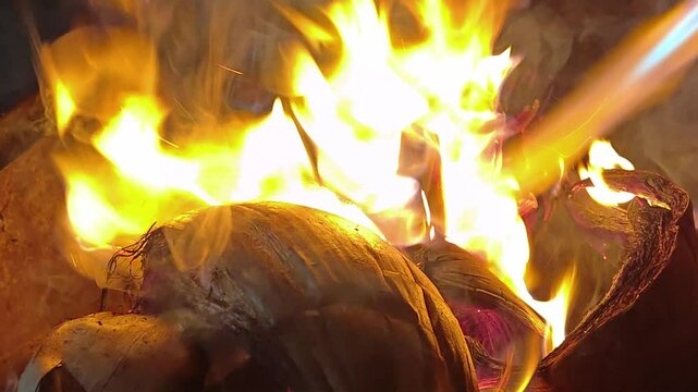 Burning coconut shells or making embers for grilling