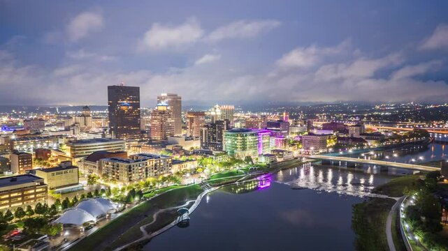 Dayton, Ohio, USA downtown cityscape on the Miami River at dusk.