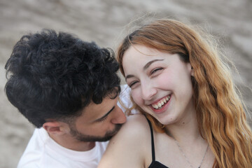 Fototapeta premium closeup portrait of a young cute loving couple outdoors
