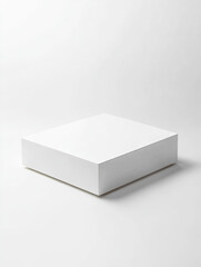 Fototapeta premium A white box, square-shaped, placed on the ground