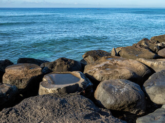 Lava Boulders on the Edge of the Ocean in Hawaii.