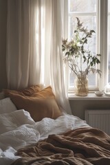 Fototapeta premium Bed with a white comforter and a brown blanket. A vase with flowers on a windowsill
