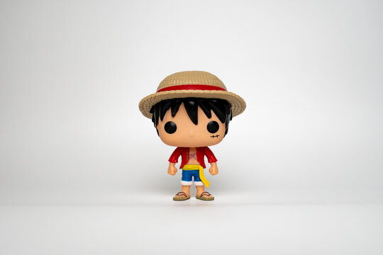 A Funko Pop figure of Monkey D Luffy stands against a white background