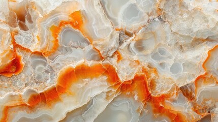 Close-up of translucent onyx stone with warm orange and cream tones, showcasing intricate natural patterns