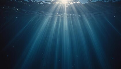 Sunlight Through Deep Blue Water: A breathtaking underwater view of the sun's rays piercing through the deep blue water, illuminating the ocean depths with ethereal light.