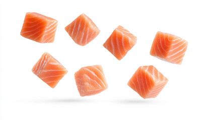 Fresh salmon cubes floating in the air against a white background