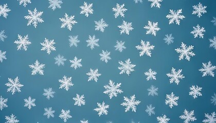 Winter Wonderland Pattern: Delicate white snowflakes arranged in a charming repeating pattern on a cool blue background, evoking a serene and festive winter atmosphere. 