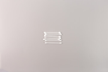 cotton swabs top view on grey background, step in creative process, DIY snowflake, Winter holiday...