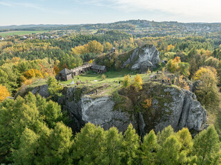 Obraz premium Aerial drone view of stronghold on Birow Hill. Reconstructed stronghold on Birow Hill in Podzamcze, Ogrodzieniec, Poland. Limestone rock hill in autumn.