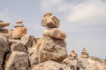balanced rock stacks tranquility and harmony in the real outside environment, mental equilibrium and meditation concept	