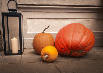 pumpkins. candles. lanterns 
composition for interior decoration

