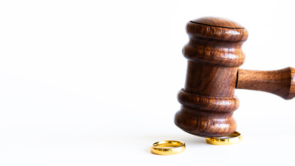 Close-up Of Wedding Rings And Wooden Gavel