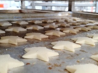 Christmas star-shaped cookies on a baking tray