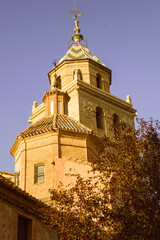 Majestic Tower of Albarracin Cathedral Against a Clear Blue Sky