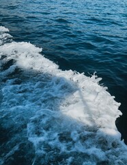 Large waves with splashes from a ship in the Adriatic sea on vacation in Montenegro