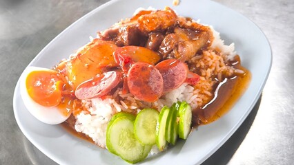 Red pork and crispy pork on rice, food in Thailand.