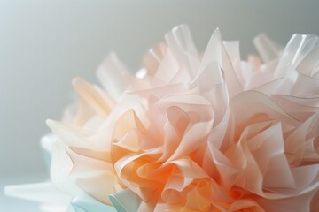 Delicate pastel-colored paper flowers bloom, resembling soft, ethereal petals that evoke a sense of whimsy and gentle elegance.