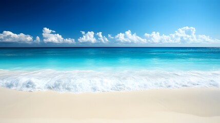 Obraz premium Sandy Beach with Turquoise Water and White Foaming Waves Under a Blue Sky