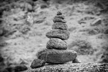 Closeup of a stone-pyramid in the mountains, Alps, black and white photo, Europe