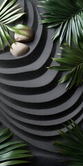 Fototapeta premium A black and white photo of a rock and a leaf. The rock is on the left side of the photo and the leaf is on the right side. The photo has a calm and peaceful mood