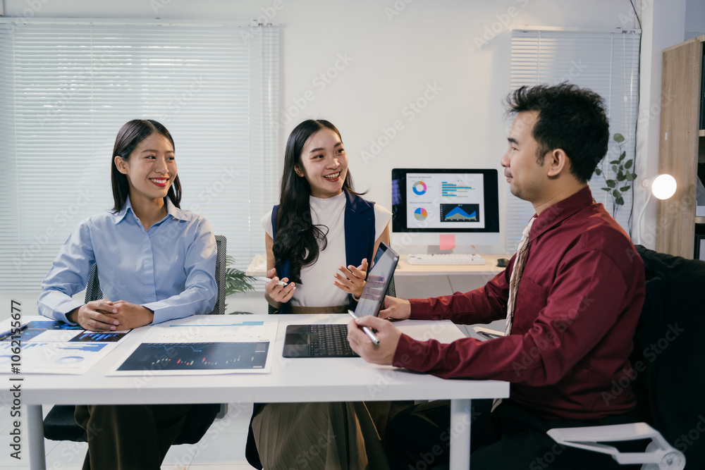 Poster Asian businesspeople are discussing marketing using charts and graphs showing positive growth, working together in a modern office environment with computers and tablets
