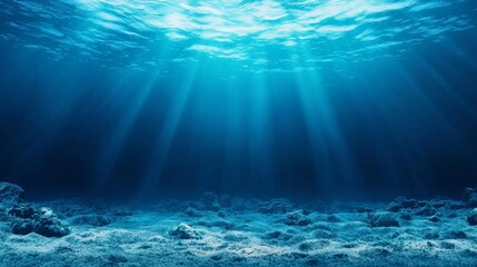 Sunlit depths. A tranquil underwater scene with sunrays and clear blue waves. Abstract background with bright sunbeams and clear seas.
