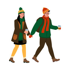 A couple enjoying a winter stroll with warm drinks in hand on a chilly day