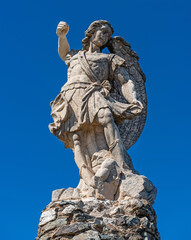 Obraz premium The statue of St. Michael the Archangel on Monte Idolo in the Santa Barbara Nature Park (Parco Naturale Santa Barbara), Sardinia
