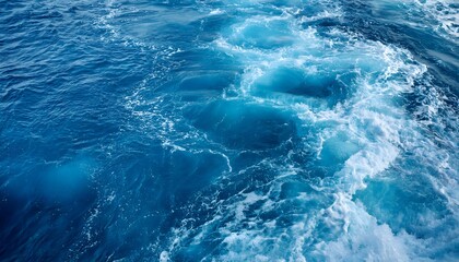 Pure blue turquoise water texture of the ocean sea with foam
