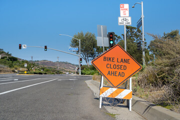 Closed bike lanes and restricted two-wheeled vehicles on a major road.