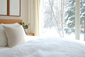 Cozy bedroom interior with snowy landscape visible through large windows