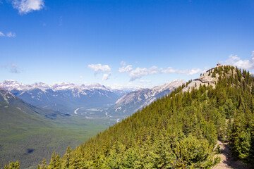 Panoramic View of Majestic Mountain Range Under Blue Sky
