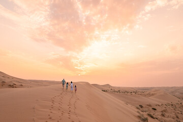 Family Enjoying Desert Sunset