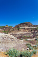 Scenic View of Rugged Badlands Under a Clear Blue Sky