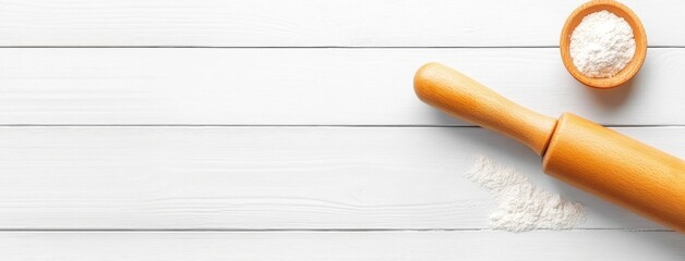 A wooden rolling pin dusted with flour rests on a white wooden surface, ideal for baking enthusiasts seeking inspiration and creativity