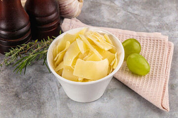 Parmesan cheese slices in the bowl
