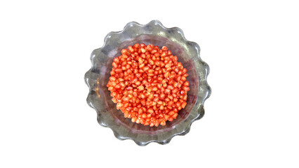 Pomegranate seeds that have been picked to be eaten fresh in glass bowl, isolated on white background