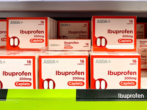 Boxes of ibuprofen on a shelf in a supermarket