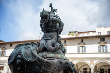 statue of a sea men as part of fountain at the market square in Florence Italy
