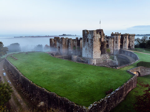 Raglan Castle in the fog at dawn, Monmouthshire, Wales, England